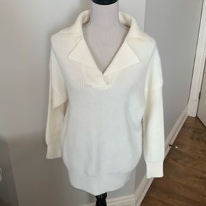 In new condition ivory sweater with large collar